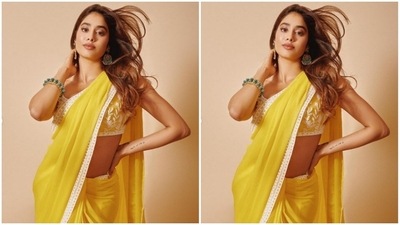 Styled by fashion stylist Tanya Ghavri, Janhvi wore her long tresses open in wavy curls with a middle part. (Instagram/@janhvikapoor)