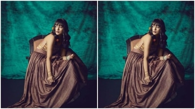 Mrunal's off-shoulder dress came with multicolour embroidered details near the midriff and a maroon flowy satin pleat details below the waist. (Instagram/@mrunalthakur)