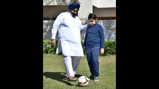 Shiromani Akali Dal’s Ludhiana West candidate Maheshinder Singh Grewal, who was seen playing football with his grandson in a park close to his residence. (Harsimar Pal Singh/HT)