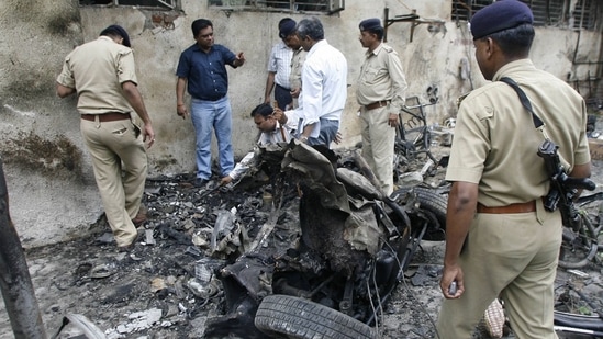 Forensic experts collecting evidence from a blast site outside the Civil Hospital in Ahmedabad. The photo was taken on July 27, 2008.&nbsp;
