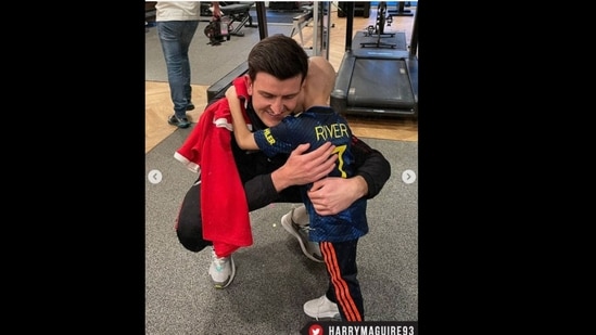 Manchester United captain Harry Maguire hugging River Rhodes, a young fan.&nbsp;(manchesterunited/Instagram )