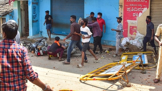 February 21, 2022: Rioters throw stones during a procession as tension spreads in Karnataka's Shivamogga over the murder of a member of Bajrang Dal on Sunday night.&nbsp;(PTI)