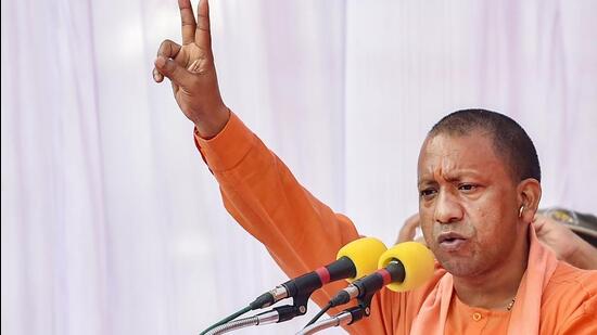 UP CM Yogi Adityanath addresses a public meeting in Lucknow on Monday. (PTI)