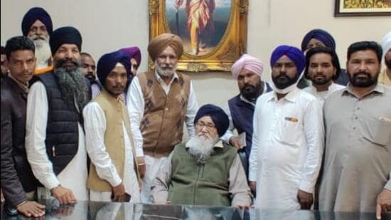 SAD patriarch Parkash Singh Badal with his supporters and aides at the family’s farmhouse in Muktsar on Monday. (HT Photo)