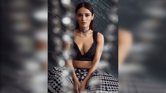 With straight sleek hair, Radhika Madan opted for subtle smokey eyes and cool-toned nude brown lips.(Instagram/@sukritigrover)