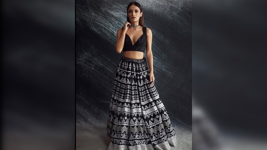 Radhika Madan kept her look simple and let her lehenga stand out by accessorising it with an oxidised silver choker.(Instagram/@sukritigrover)
