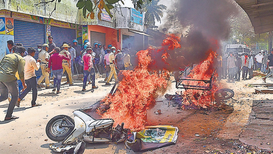 Vehicles were set on fire by rioters in Shivamogga district on Monday (PTI) Vehicles were set on fire by rioters in Shivamogga district on Monday (PTI)