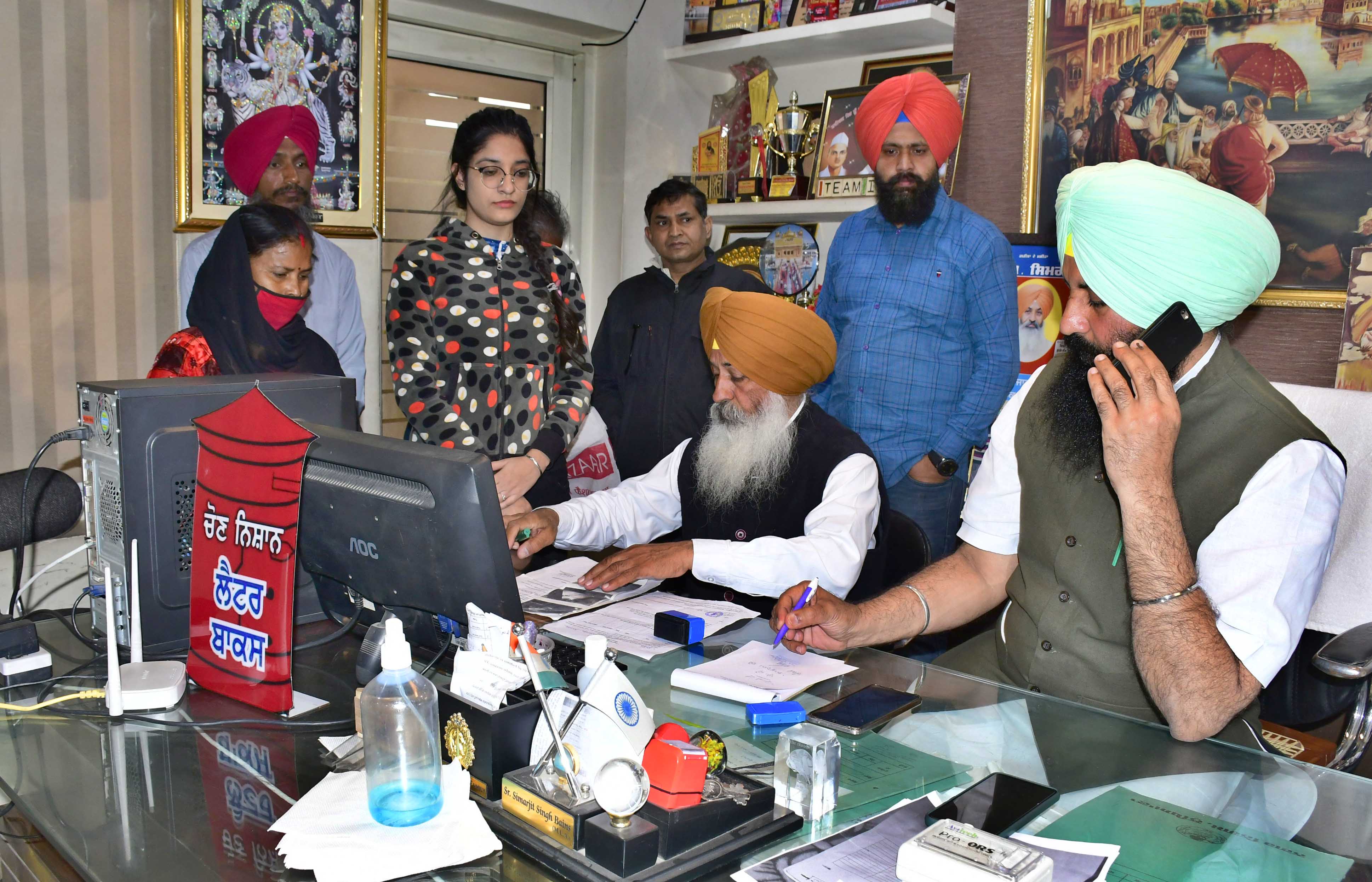 Lok Insaaf Party chief Simarjit Singh Bains and MLA Balwinder Singh Bains meeting people at their office in Ludhiana on Monday. (Harsimar Pal Singh/HT)