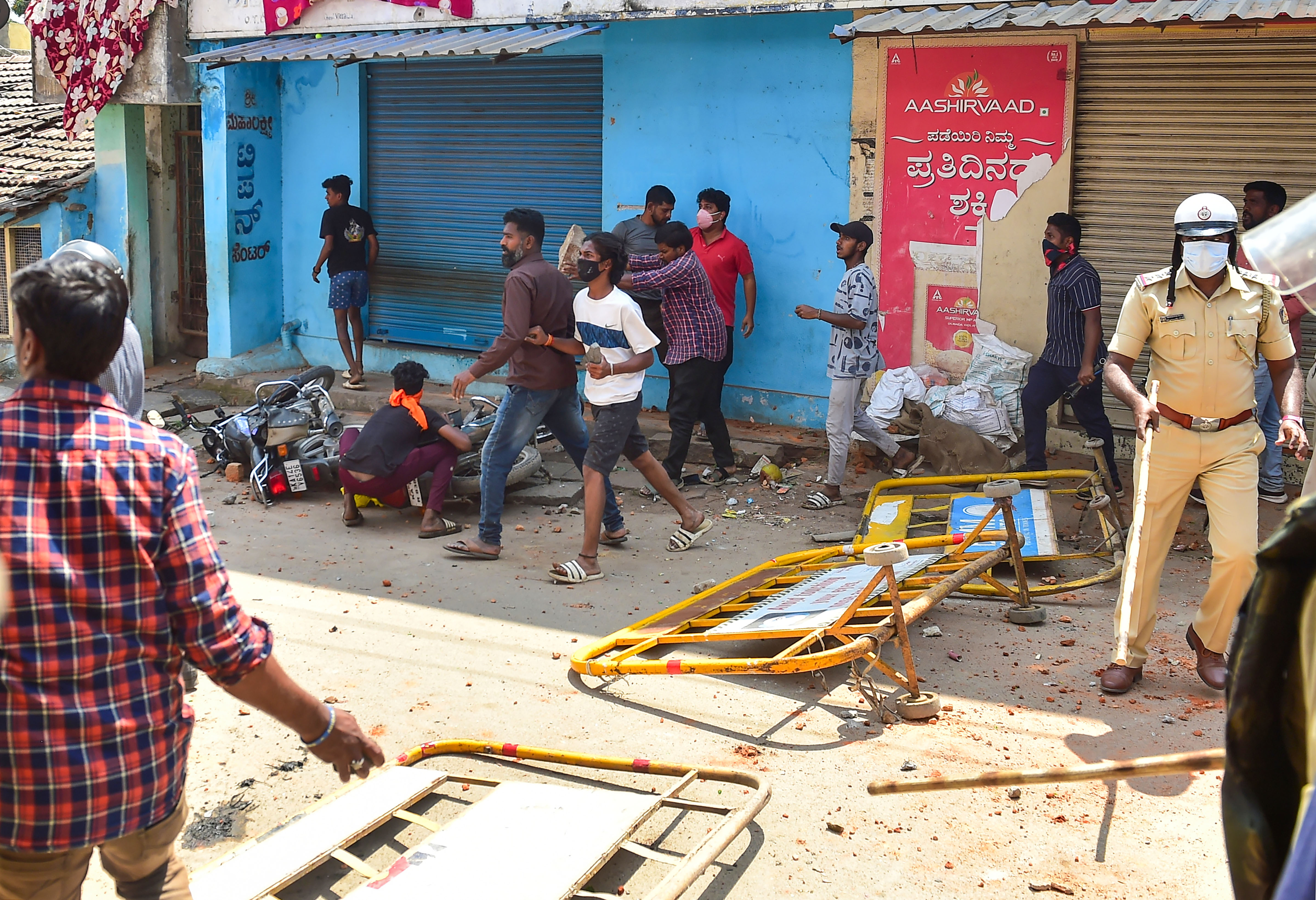 February 21, 2022: Rioters throw stones during a procession as tension spreads in Karnataka's Shivamogga over the murder of a member of Bajrang Dal on Sunday night. (PTI) February 21, 2022: Rioters throw stones during a procession as tension spreads in Karnataka's Shivamogga over the murder of a member of Bajrang Dal on Sunday night. (PTI)