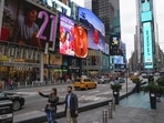 Pedestrians walk through Times Square in New York. (AP) Pedestrians walk through Times Square in New York. (AP)