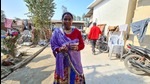 Village head of Bela Persua, a Tharu tribe village of Lakhimpur Kheri district, Lakshmi Devi showing SIM card of a Nepal telecom company. (HT) Village head of Bela Persua, a Tharu tribe village of Lakhimpur Kheri district, Lakshmi Devi showing SIM card of a Nepal telecom company. (HT)