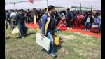 Polling officials carrying Electronic Voting Machines and other polling equipment after collecting it from the distribution centre, for the fourth phase of the Uttar Pradesh Assembly Election in Lucknow on Tuesday. (Agency) Polling officials carrying Electronic Voting Machines and other polling equipment after collecting it from the distribution centre, for the fourth phase of the Uttar Pradesh Assembly Election in Lucknow on Tuesday. (Agency)