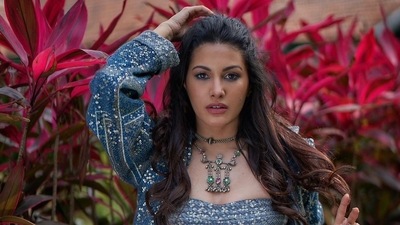 Move over snug and stylish this season and take a crash course on sultry fashion from Bollywood actor Amyra Dastur who sizzled the glam quotient in an indigo sartorial pantsuit teamed with a matching bling bralette. (Instagram/amyradastur93) Move over snug and stylish this season and take a crash course on sultry fashion from Bollywood actor Amyra Dastur who sizzled the glam quotient in an indigo sartorial pantsuit teamed with a matching bling bralette. (Instagram/amyradastur93)
