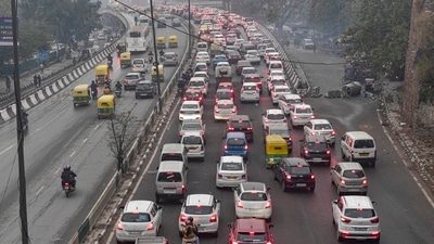 Traffic moves at slow place on the Ring Road following rains, in New Delhi. (PTI) Traffic moves at slow place on the Ring Road following rains, in New Delhi. (PTI)