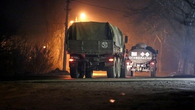 Military trucks move down a street outside Donetsk, the territory controlled by pro-Russian militants, eastern Ukraine. (AP) Military trucks move down a street outside Donetsk, the territory controlled by pro-Russian militants, eastern Ukraine. (AP)