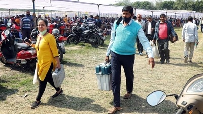 Polling officials carrying Electronic Voting Machines and other polling equipment after collecting it from the distribution center, for the fourth phase of the Uttar Pradesh Assembly Election, in Lucknow. (ANI) Polling officials carrying Electronic Voting Machines and other polling equipment after collecting it from the distribution center, for the fourth phase of the Uttar Pradesh Assembly Election, in Lucknow. (ANI)