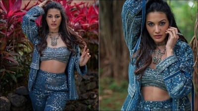 Amyra Dastur accessorised her look with a statement silver neckpiece from The Chandi Studio while her ensemble is credited to Indian fashion designer Nikita Mhaisalkar’s eponymous luxury pret label that prides in luxuriously detailed hand embroidery, luxe rich textiles and focuses on practicality and movement even for the most visionary outfits. The pantsuit set originally costs  <span class='webrupee'>₹</span>38,500 on her designer website. (Instagram/amyradastur93)
