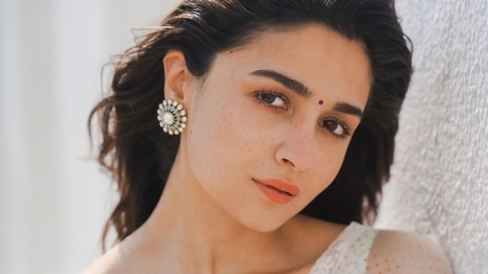 Taking to her social media handle, the diva shared a slew of pictures featuring in donning a white base blouse that came with straps and a sweetheart neckline to ooze oomph while sporting tiny multi-coloured polka dots. (Instagram/aliaabhatt)