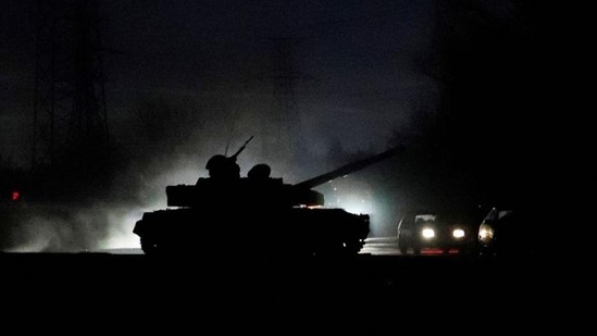 A tank drives along a street after Russian President Vladimir Putin ordered the deployment of Russian troops to two breakaway regions in eastern Ukraine.