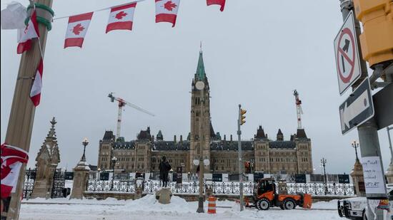 City employees clean up Wellington Street in front of Parliament Hill, previously occupied by the Freedom Convoy, in Ottawa, Ontario, Canada. (AFP)