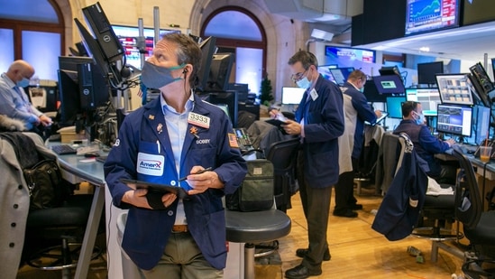 Traders work on the New York Stock Exchange floor in New York.(AP)