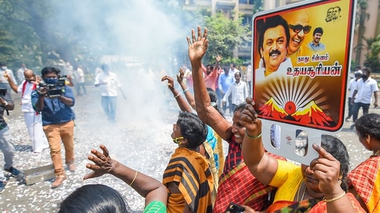 DMK party workers holding placards of Party President and Tamil Nadu CM M.K Stalin, celebrate after the party's lead in the local body elections, at the party headquarters, in Chennai.&nbsp;(PTI)