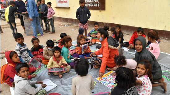 A volunteer takes a class for homeless children on the roadside in Patna. (ANI PHOTO/FIle) A volunteer takes a class for homeless children on the roadside in Patna. (ANI PHOTO/FIle)