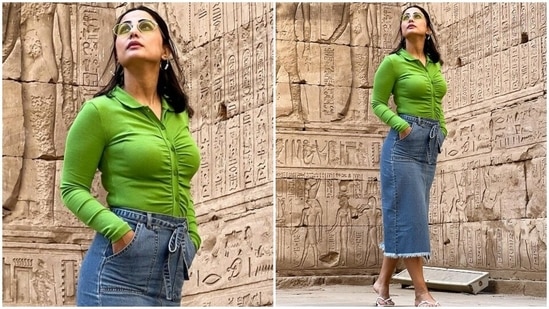 Hina posed for the photoshoot wearing a trendy top and midi skirt set. The collared top comes in a bright parrot green shade. It comes with a cropped hemline, gathered design on the front, button-up details, long sleeves, and a bodycon fit accentuating the star's frame.(Instagram/@realhinakhan)
