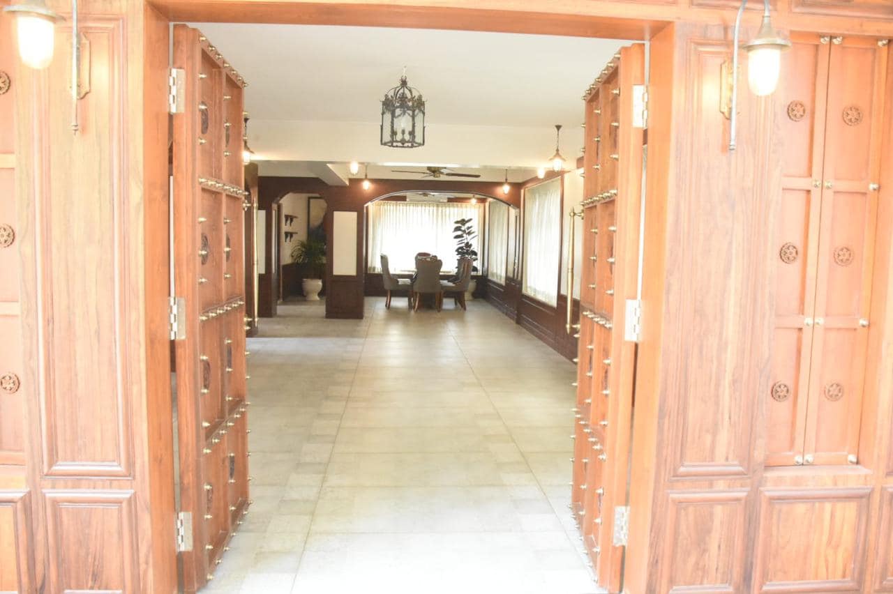 Heavy wooden doors separate the two areas.