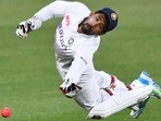 Wriddhiman Sava dives to grab the ball. (Getty) Wriddhiman Sava dives to grab the ball. (Getty)