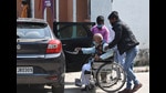 An old man on a wheelchair after casting his vote at a polling station in Lucknow, on Wednesday . (Deepak Gupta/HT)