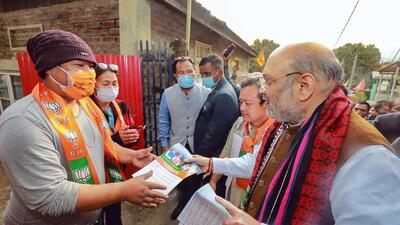 Union home minister Amit Shah during a door to door campaign for assembly polls, in Churachandpur (Manipur) on Wednesday. (PTI) Union home minister Amit Shah during a door to door campaign for assembly polls, in Churachandpur (Manipur) on Wednesday. (PTI)