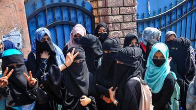 Chikmagalur: Students stand outside a college as they boycott classes after being denied entry with 'hijab' in the college premises, in Chikmagalur, Monday, Feb. 21, 2022. (PTI Photo)(PTI02_21_2022_000066B) (PTI)