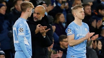 Cole Palmer with Manchester City manager Pep Guardiola before coming on as a substitute to replace Phil Foden while Oleksandr Zinchenko looks on. (REUTERS/File Photo)