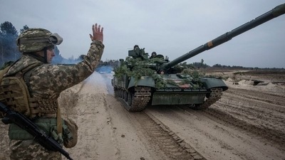 Ukrainian service members take part in tactical drills at a training ground in an unknown location in Ukraine. (Reuters)