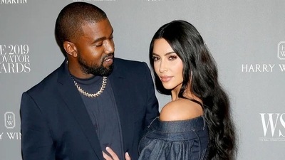 Kim Kardashian and Kanye West at an event. Kim Kardashian and Kanye West at an event.