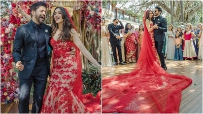 Shibani Dandekar embraced the colour of love, red, for her wedding day and wore a strapless beige corset top and lehenga set adorned with a stunning red lace overlay. Her skirt featured a bodycon silhouette with a flowy hem that extended into a floor-grazing train. She rounded off the look with a gorgeous red sheer veil. (Instagram/@faroutakhtar, @shibanidandekar) Shibani Dandekar embraced the colour of love, red, for her wedding day and wore a strapless beige corset top and lehenga set adorned with a stunning red lace overlay. Her skirt featured a bodycon silhouette with a flowy hem that extended into a floor-grazing train. She rounded off the look with a gorgeous red sheer veil. (Instagram/@faroutakhtar, @shibanidandekar)