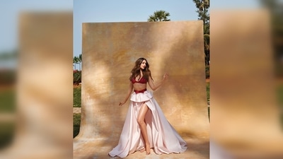 Ananya Panday posed like a princess straight out of a fairy tale in a red embroidered bralette and a thigh-high slit floor-sweeping white skirt with frill around the waist. (Filmfare/Instagram/@anaitashroffadajania) Ananya Panday posed like a princess straight out of a fairy tale in a red embroidered bralette and a thigh-high slit floor-sweeping white skirt with frill around the waist. (Filmfare/Instagram/@anaitashroffadajania)