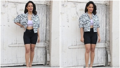 The jacket has an animal print in black and white shade, wide collars, frayed hem, button-up front that Masaba left open to show off the bralette, oversized silhouette, drooping shoulders, and scrunched-up sleeves. She rounded off the outfit with black biker shorts featuring a bodycon fitting and a drawstring detail on the waist. (HT Photo/Varinder Chawla) The jacket has an animal print in black and white shade, wide collars, frayed hem, button-up front that Masaba left open to show off the bralette, oversized silhouette, drooping shoulders, and scrunched-up sleeves. She rounded off the outfit with black biker shorts featuring a bodycon fitting and a drawstring detail on the waist. (HT Photo/Varinder Chawla)