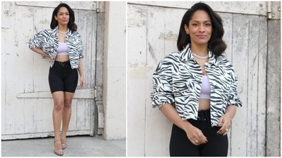 Masaba's ensemble featured a bralette that comes in a pleasing lavender shade, a plunging U neckline, and a cropped hem that hinted at the star's washboard abs. She layered the top with a trendy cropped jacket in a black and white pattern. (HT Photo/Varinder Chawla) Masaba's ensemble featured a bralette that comes in a pleasing lavender shade, a plunging U neckline, and a cropped hem that hinted at the star's washboard abs. She layered the top with a trendy cropped jacket in a black and white pattern. (HT Photo/Varinder Chawla)