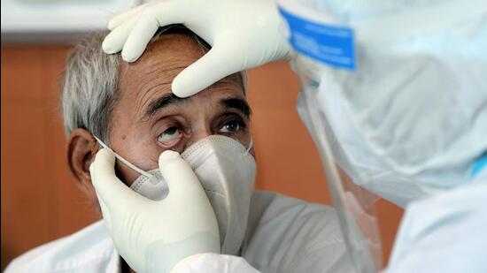 A doctor examines a COVID-19 patient for black fungus infection. (FILE PHOTO)