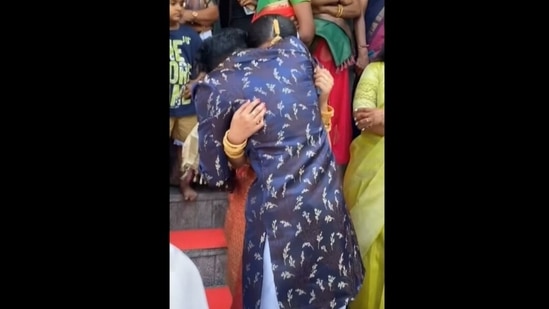 The image, taken from the Instagram video, shows the brother embracing his sister.(Instagram/@_abhiramek_)