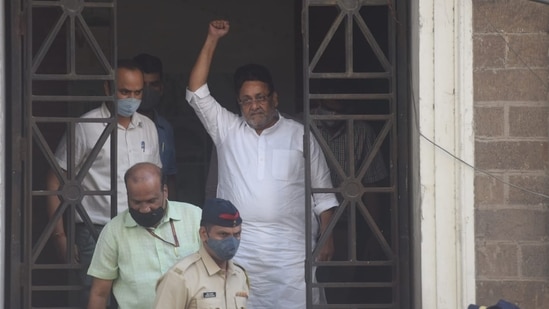 Maharashtra minister Nawab Malik leaves the ED office in Mumbai on Wednesday.(Satish Bate/HT Photo)