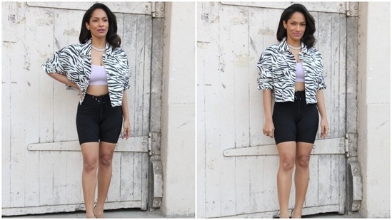 The jacket has an animal print in black and white shade, wide collars, frayed hem, button-up front that Masaba left open to show off the bralette, oversized silhouette, drooping shoulders, and scrunched-up sleeves. She rounded off the outfit with black biker shorts featuring a bodycon fitting and a drawstring detail on the waist.(HT Photo/Varinder Chawla)