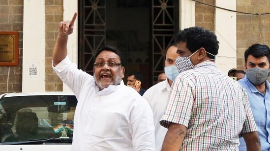 Maharashtra cabinet minister Nawab Malik raise slogans as he is being taken for medical examination after being brought out of the Enforcement Directorate office, in Mumbai on Wednesday, February 23. 2022. (ANI Photo)(Nitin Lawate)
