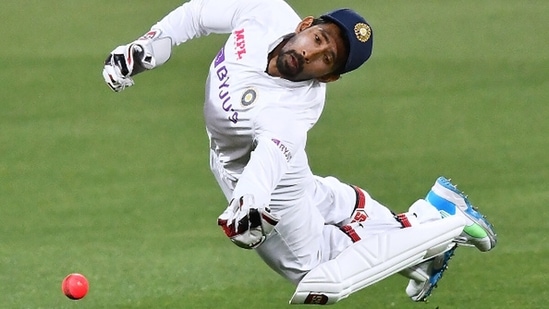 Wriddhiman Sava dives to grab the ball. (Getty) Wriddhiman Sava dives to grab the ball. (Getty)