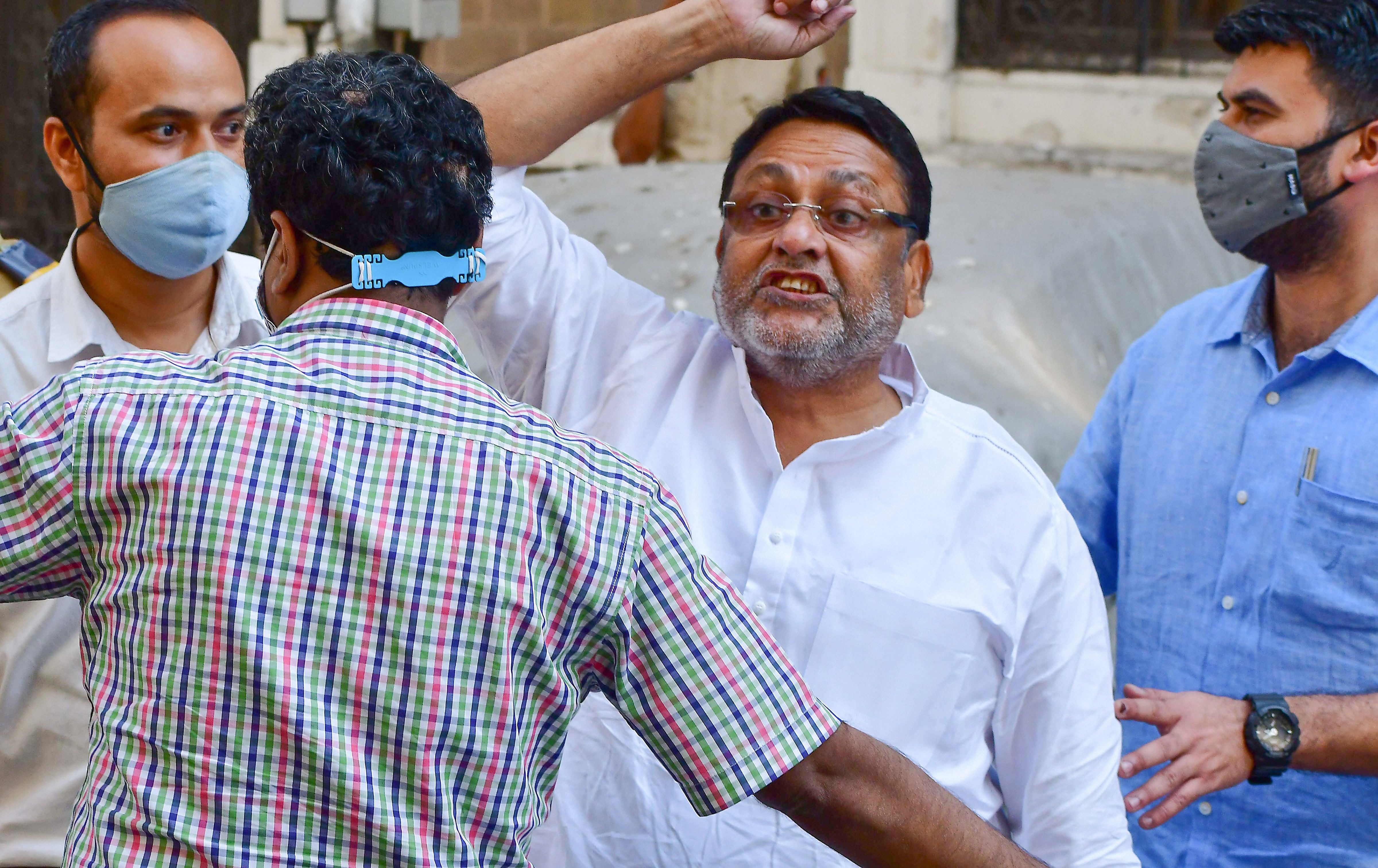 NCP leader and Maharashtra Minister Nawab Malik being taken for a medical test after his arrest by the ED in Mumbai on Wednesday. (PTI) NCP leader and Maharashtra Minister Nawab Malik being taken for a medical test after his arrest by the ED in Mumbai on Wednesday. (PTI)