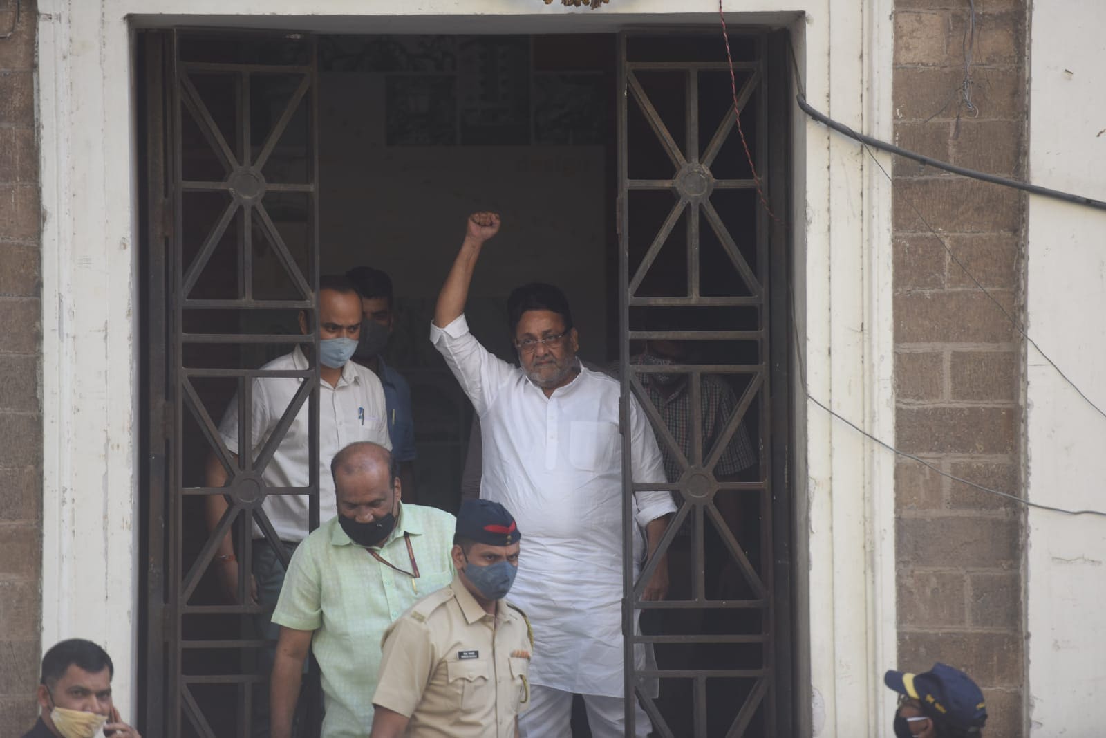 Maharashtra minister Nawab Malik leaves the ED office in Mumbai on Wednesday. (Satish Bate/HT Photo) Maharashtra minister Nawab Malik leaves the ED office in Mumbai on Wednesday. (Satish Bate/HT Photo)