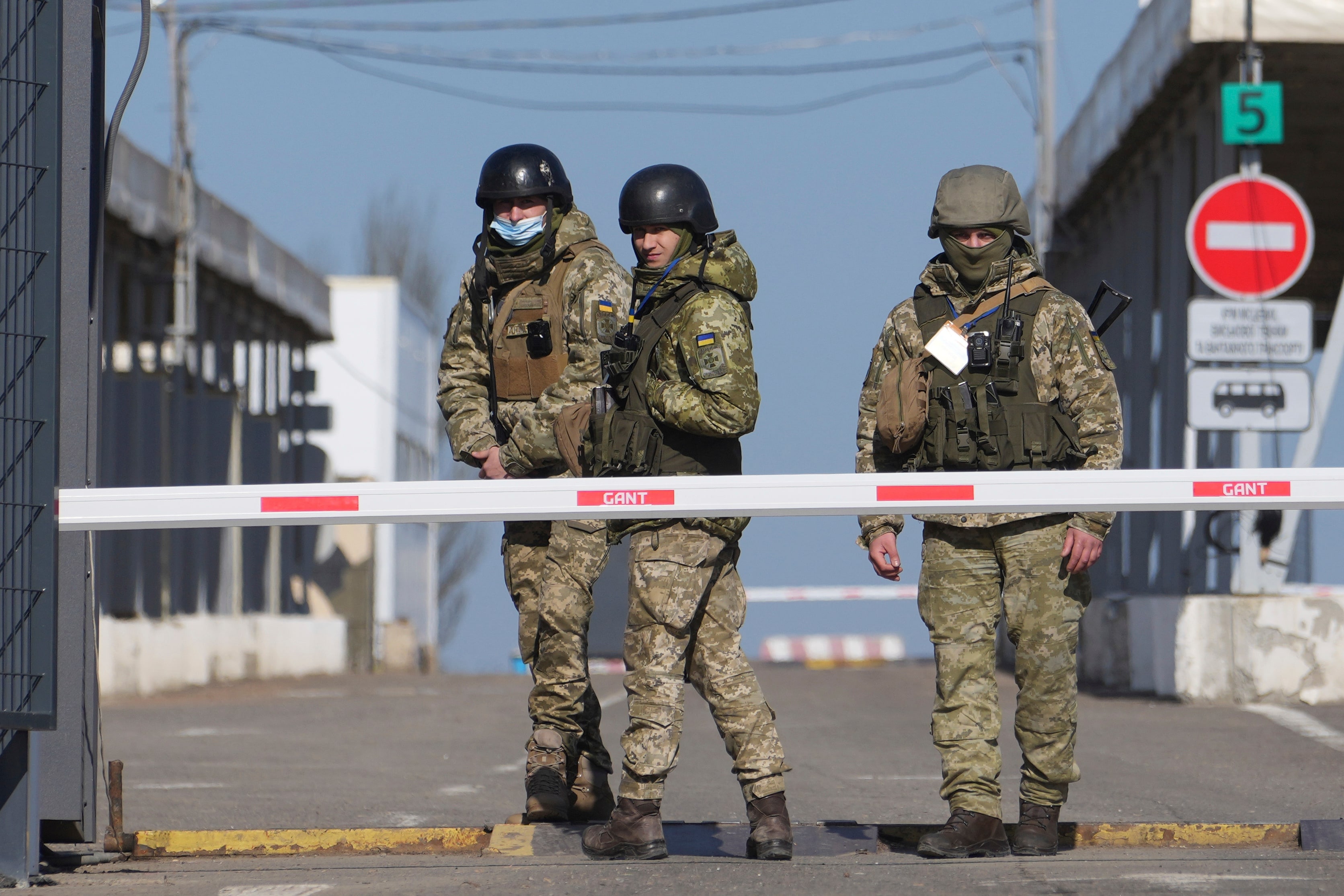 Ukrainian border guards stand at a checkpoint from territory controlled by Russia-backed separatists to the territory controlled by Ukrainian forces in Novotroitske, eastern Ukraine.&nbsp; (AP)