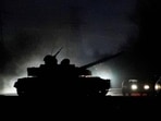 A tank drives along a street after Russian President ordered the deployment of Russian troops in eastern Ukraine. A tank drives along a street after Russian President ordered the deployment of Russian troops in eastern Ukraine.